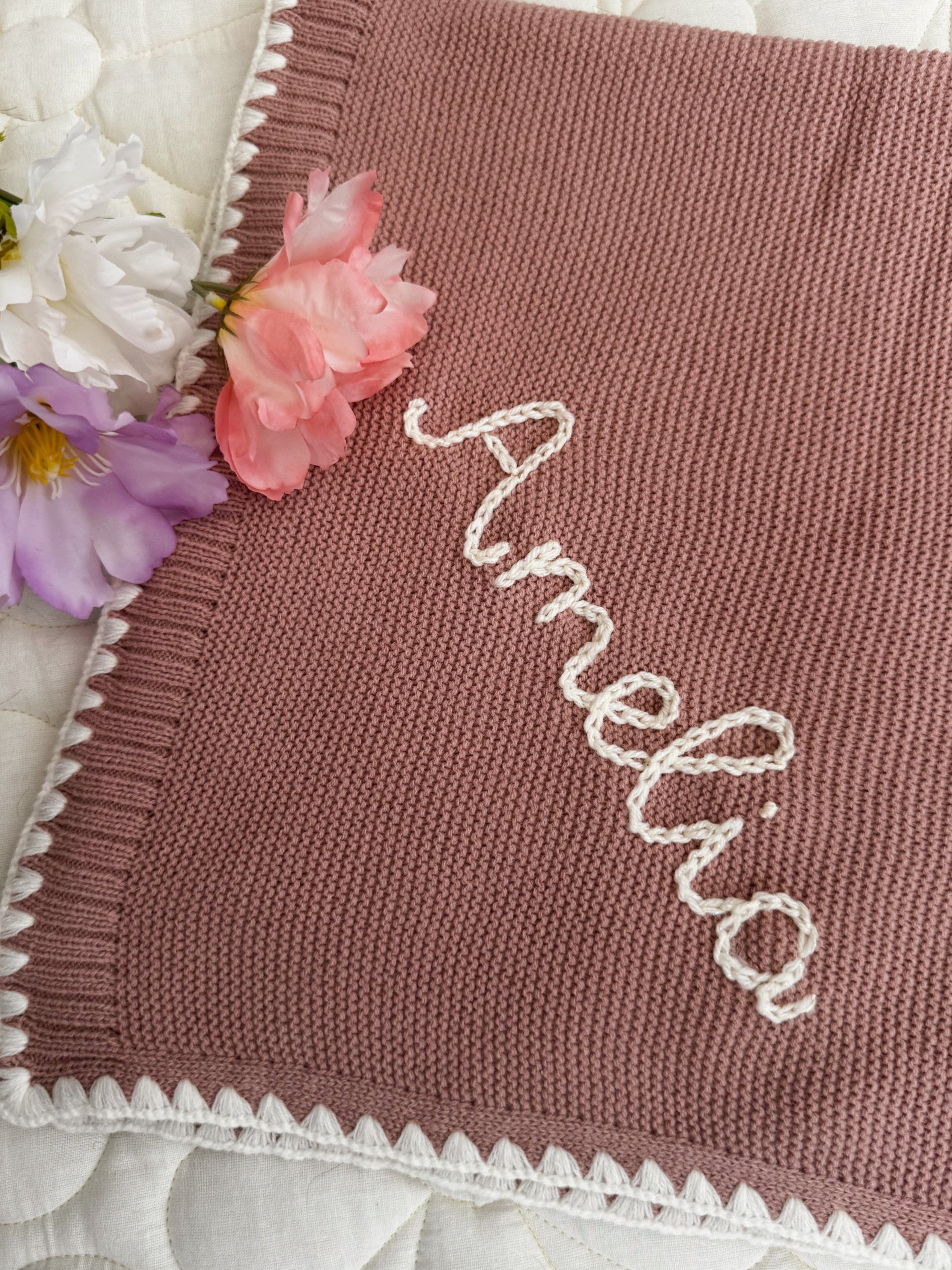 Bound edge baby blanket with name embroidery