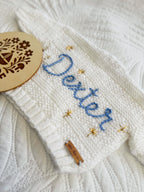 White cardigan, periwinkle name & gold stars