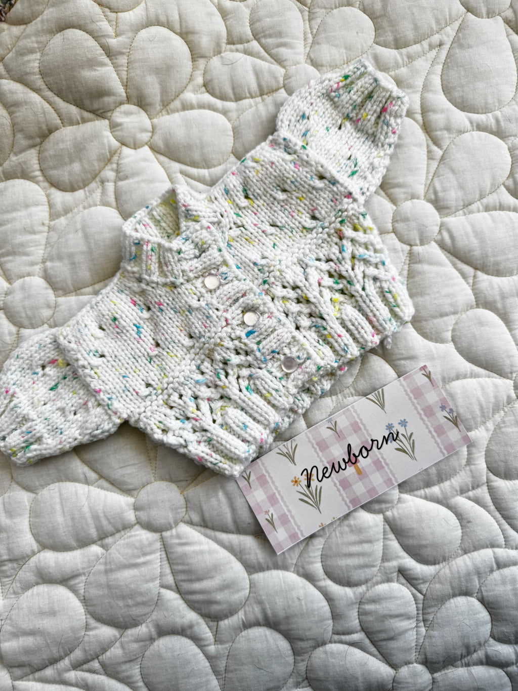 Newborn speckled multicoloured hand knit