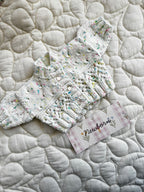 Newborn speckled multicoloured hand knit