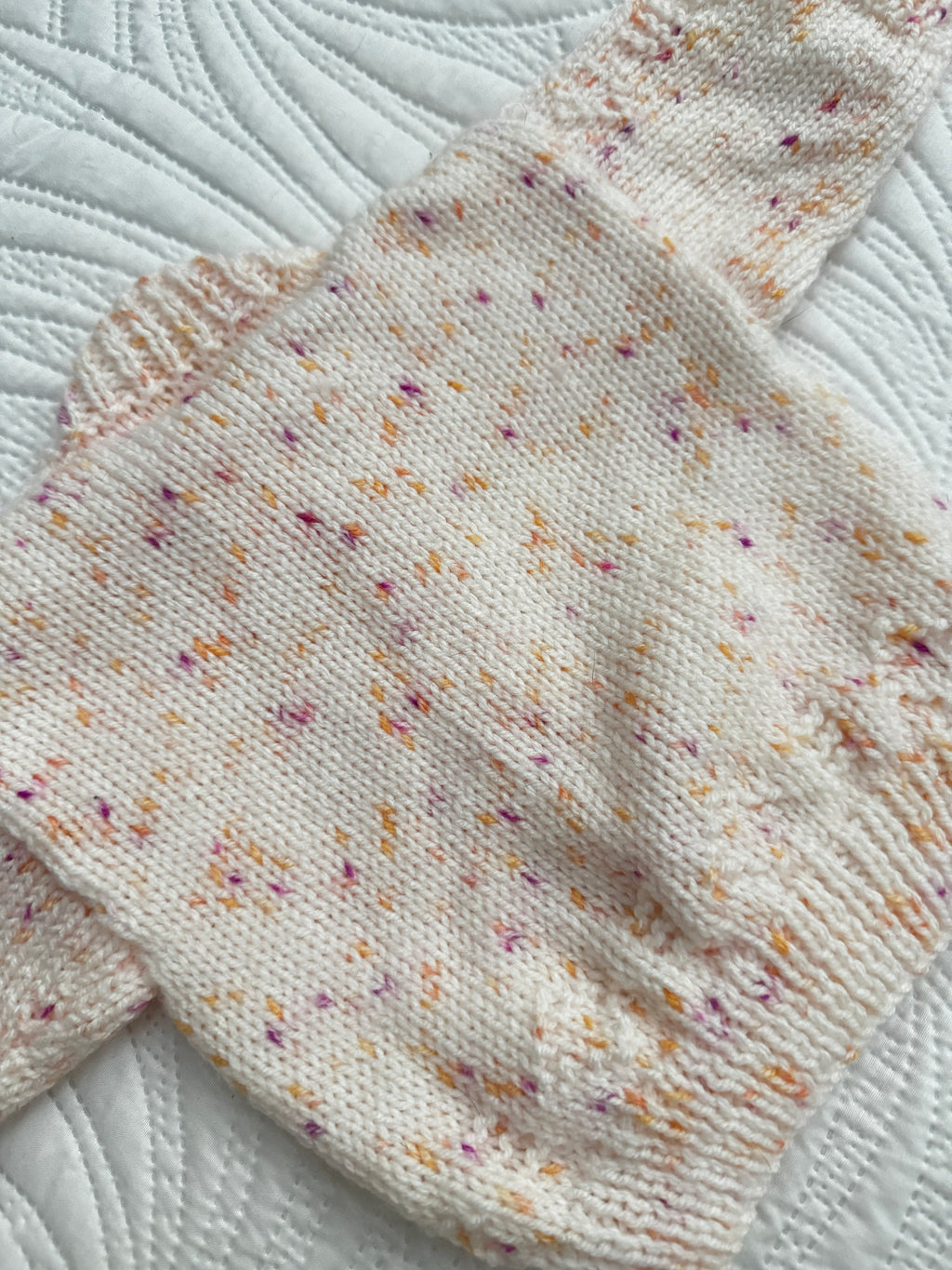 0-6 peachy fleck hand knit