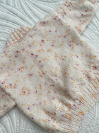 0-6 peachy fleck hand knit